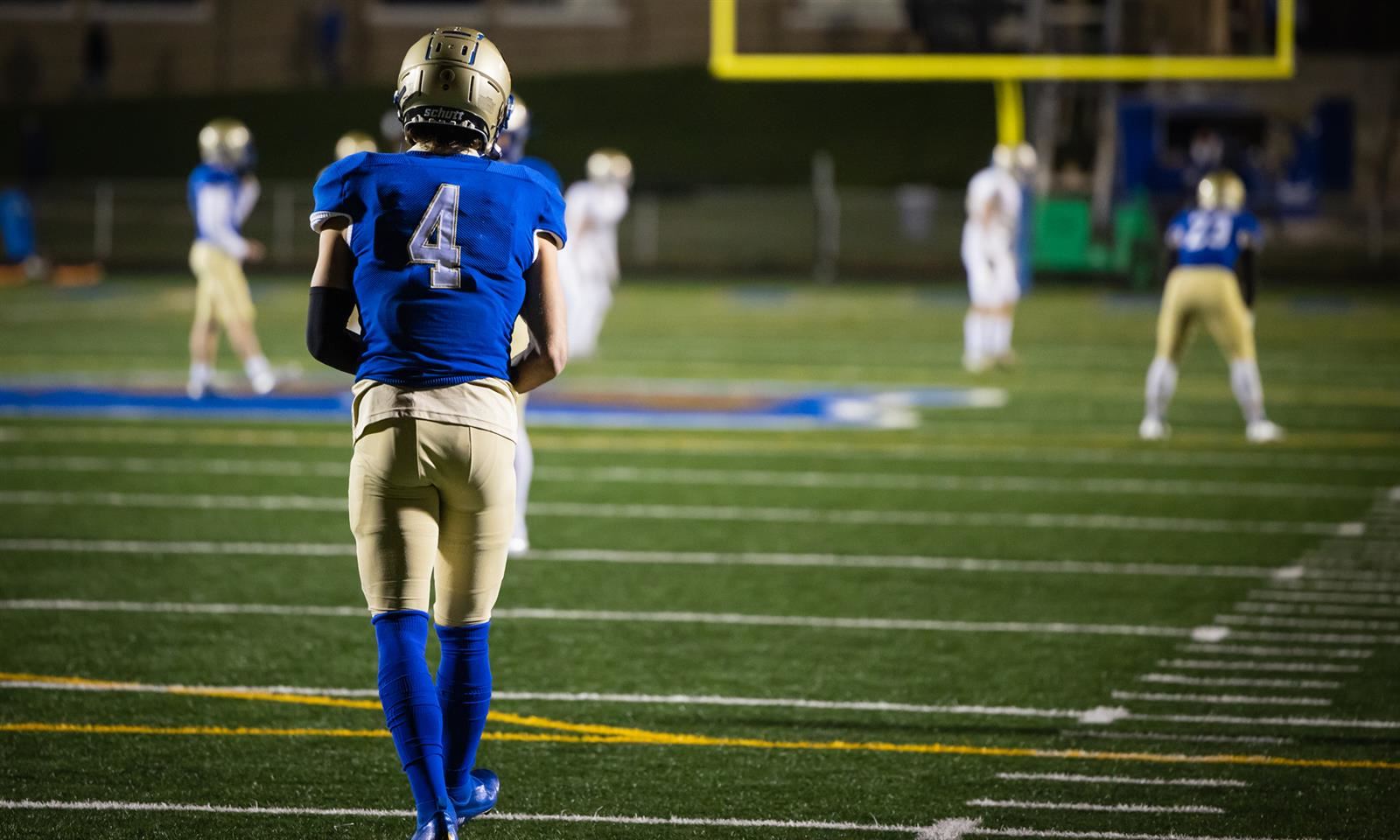 A football player stands on the field